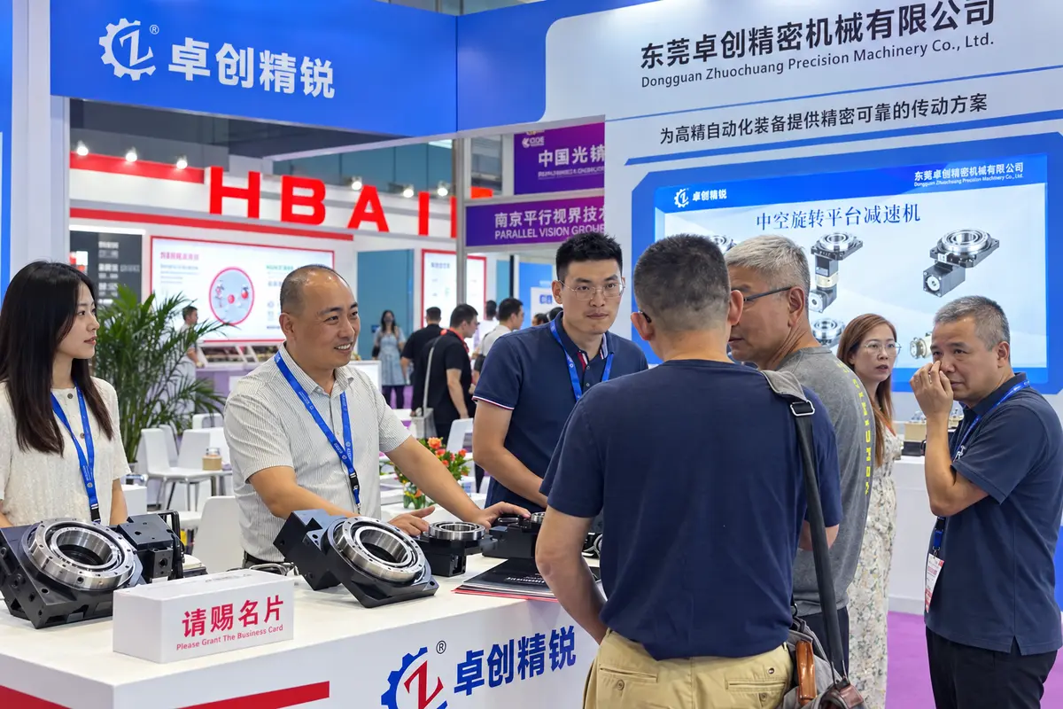 Visitors discussing precision motion products with the Zhuochuang team