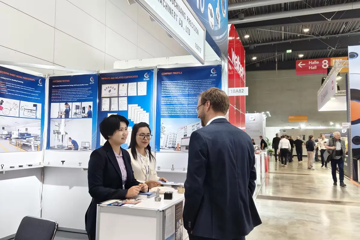 Zhuochuang team meeting an international visitor at AMB 2026 Stuttgart Booth 10A72